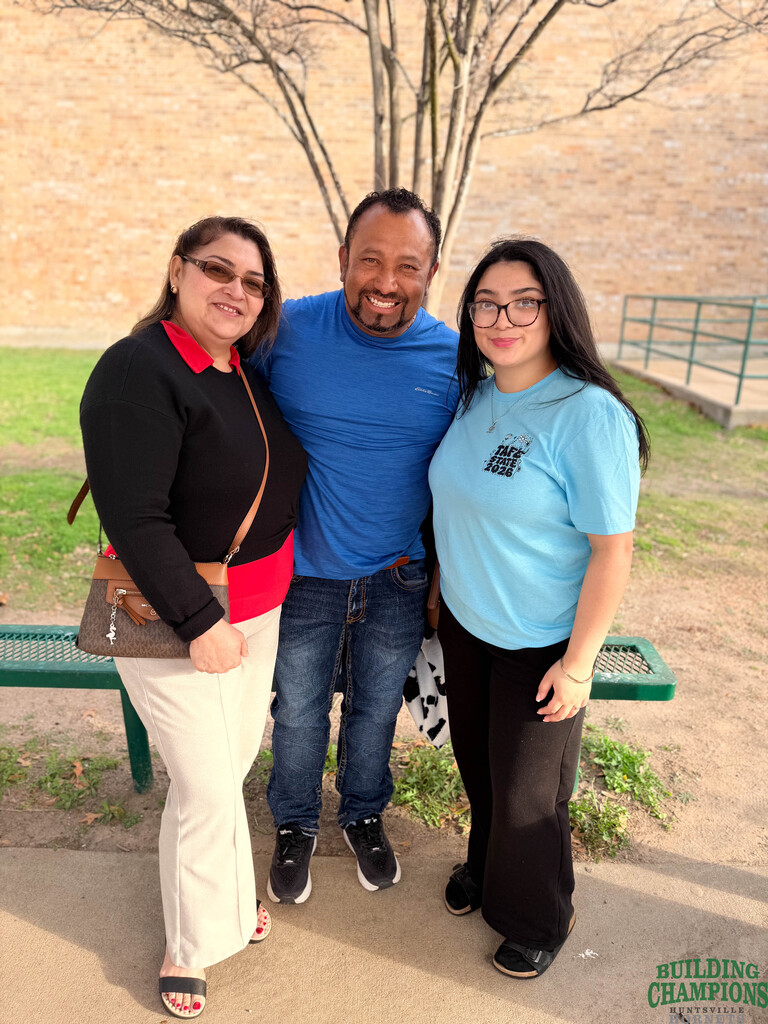 Mom and dad with their student