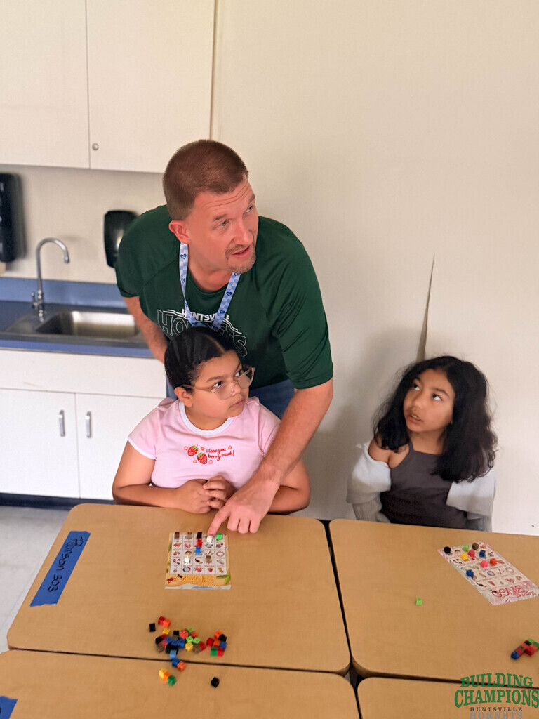 Teacher helping student with work