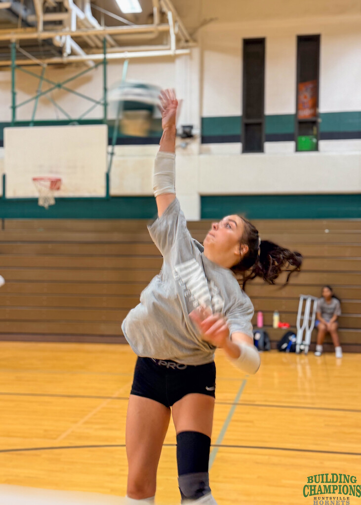 intense moment with volleyball student- all muscles flexed
