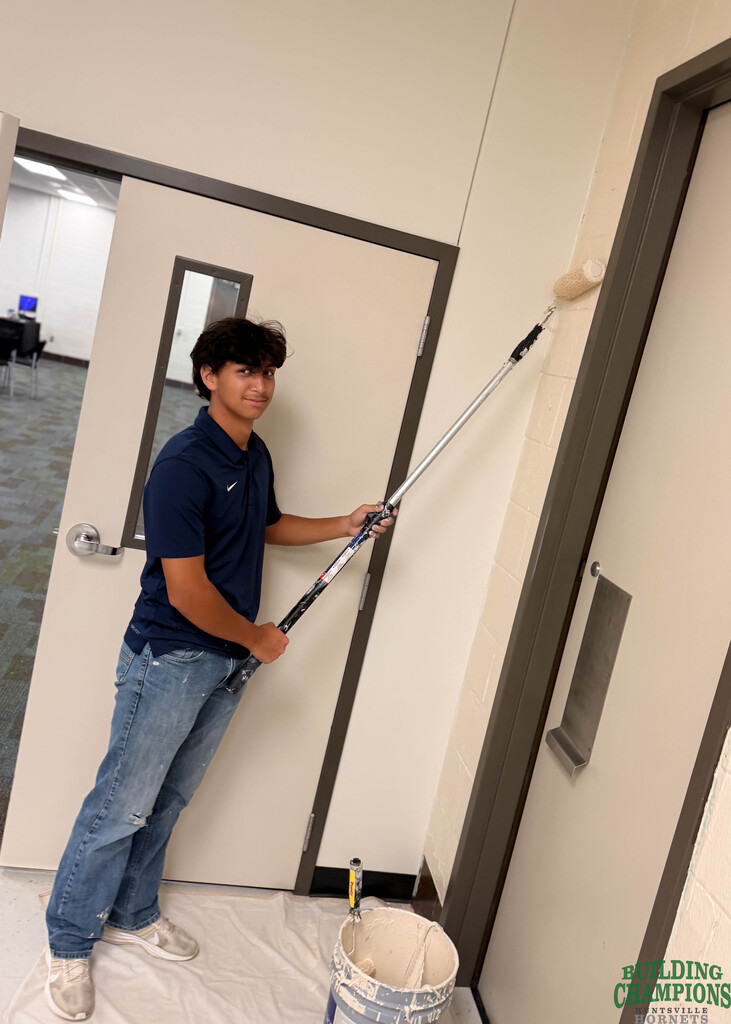student painter using roller