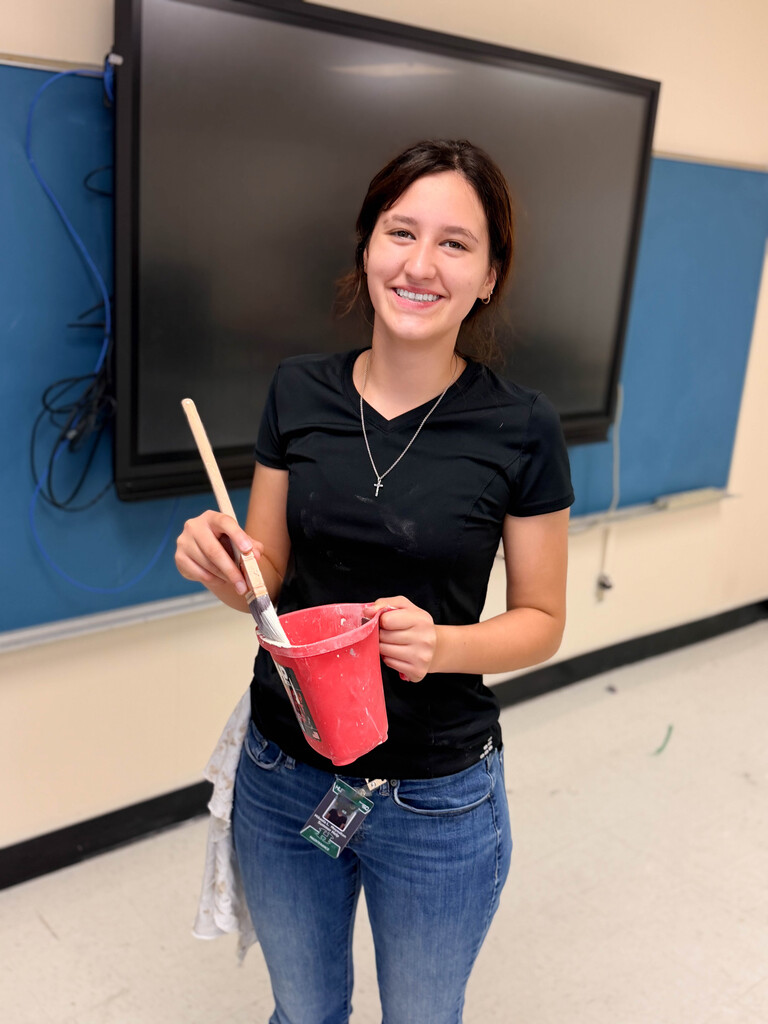 Volleyball player holding paint bucket