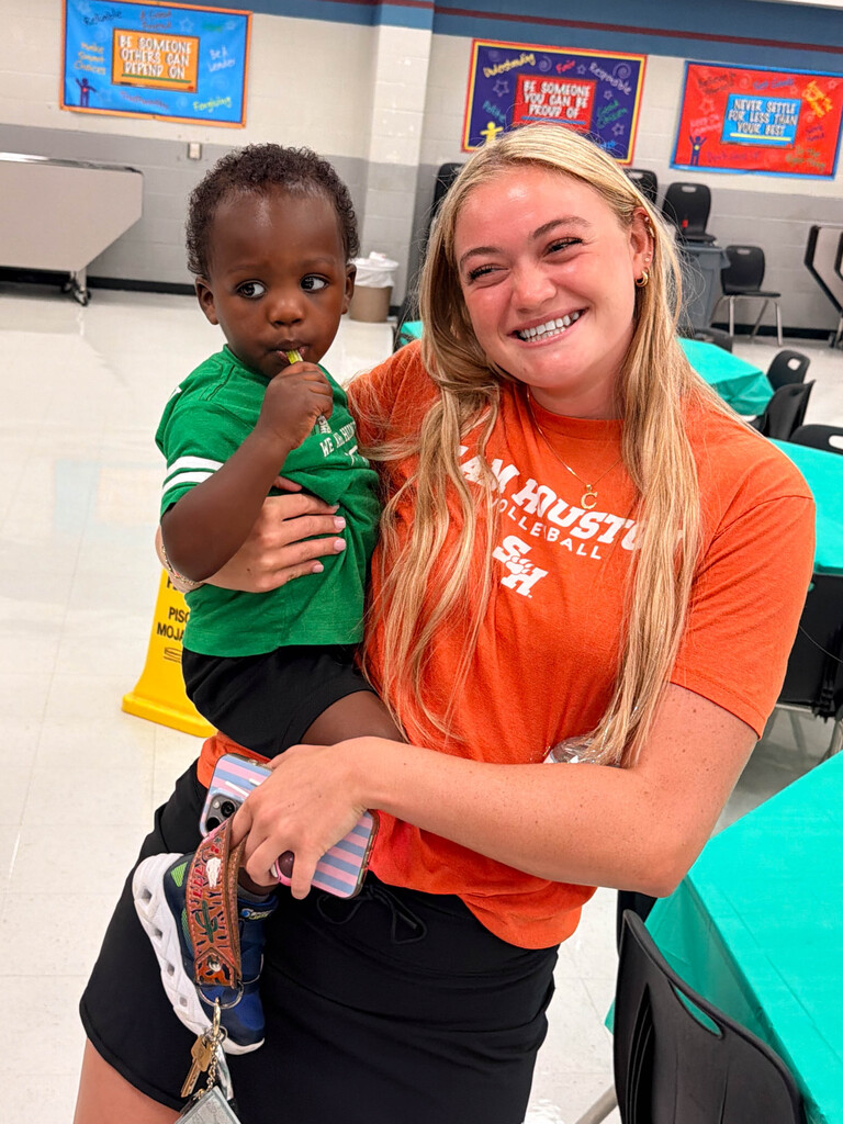 Girl holding baby