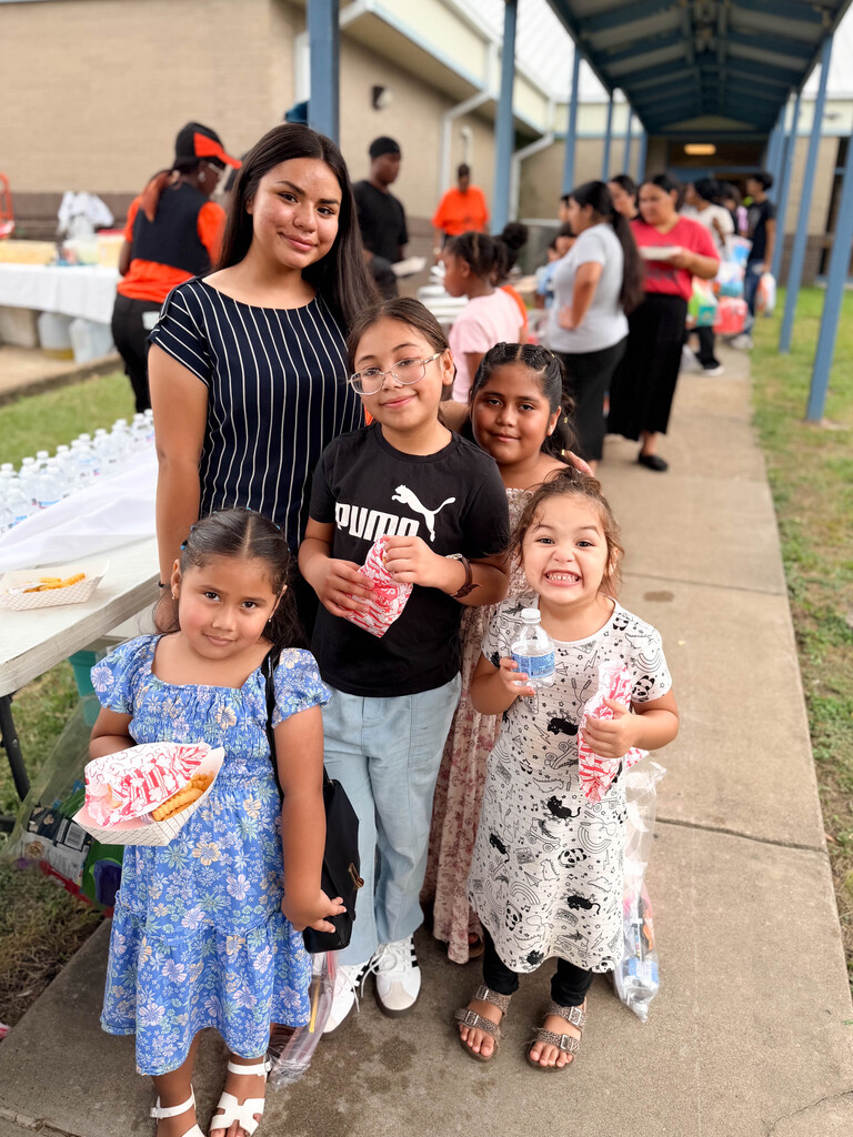 Family with supplies and fish fry