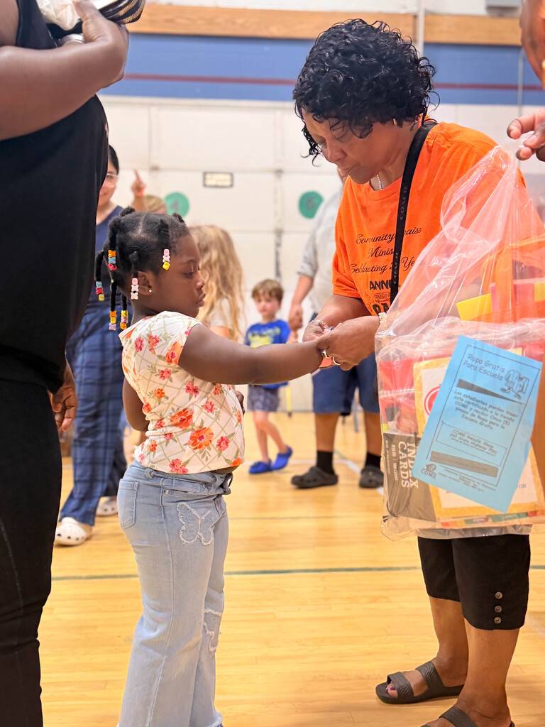 Lady helping girl