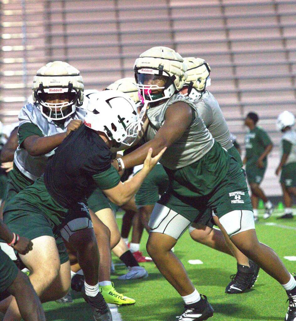 Tight frame on an action shot- defenders and offensive line meet
