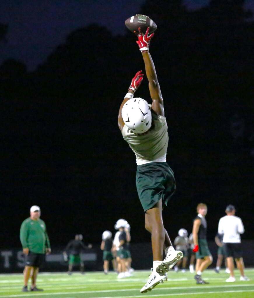 athlete reaching for the ball