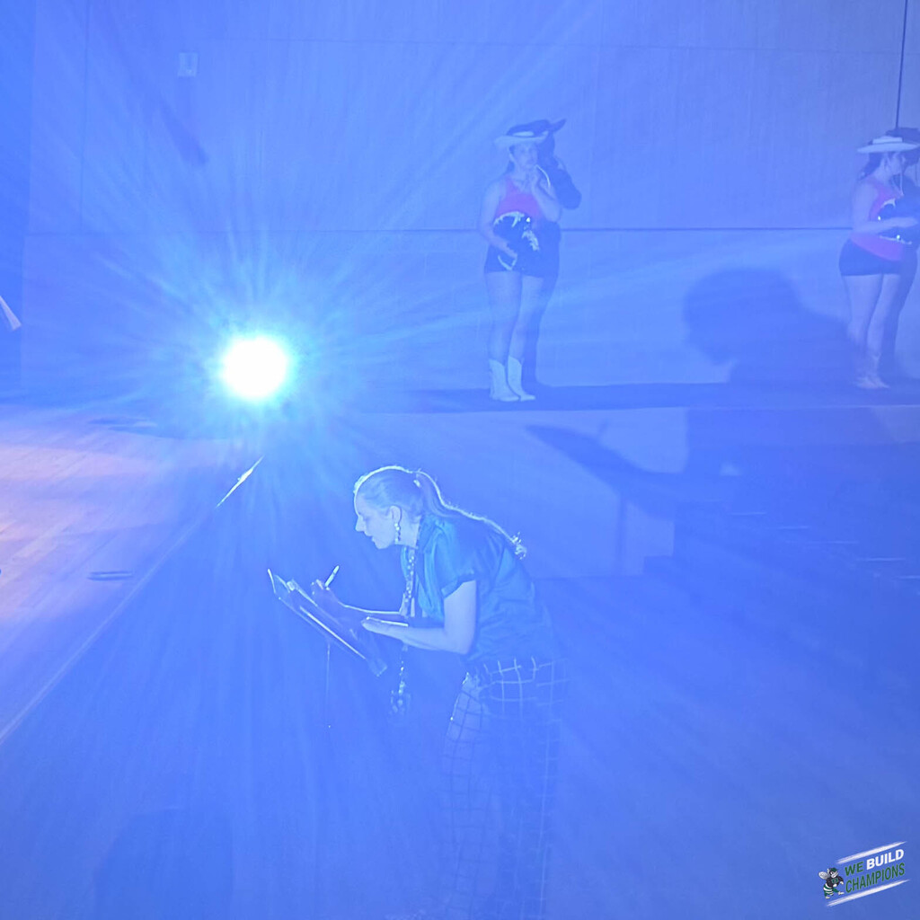 Another artisitic show, this time with the choir director making an annotation bathed in blue light