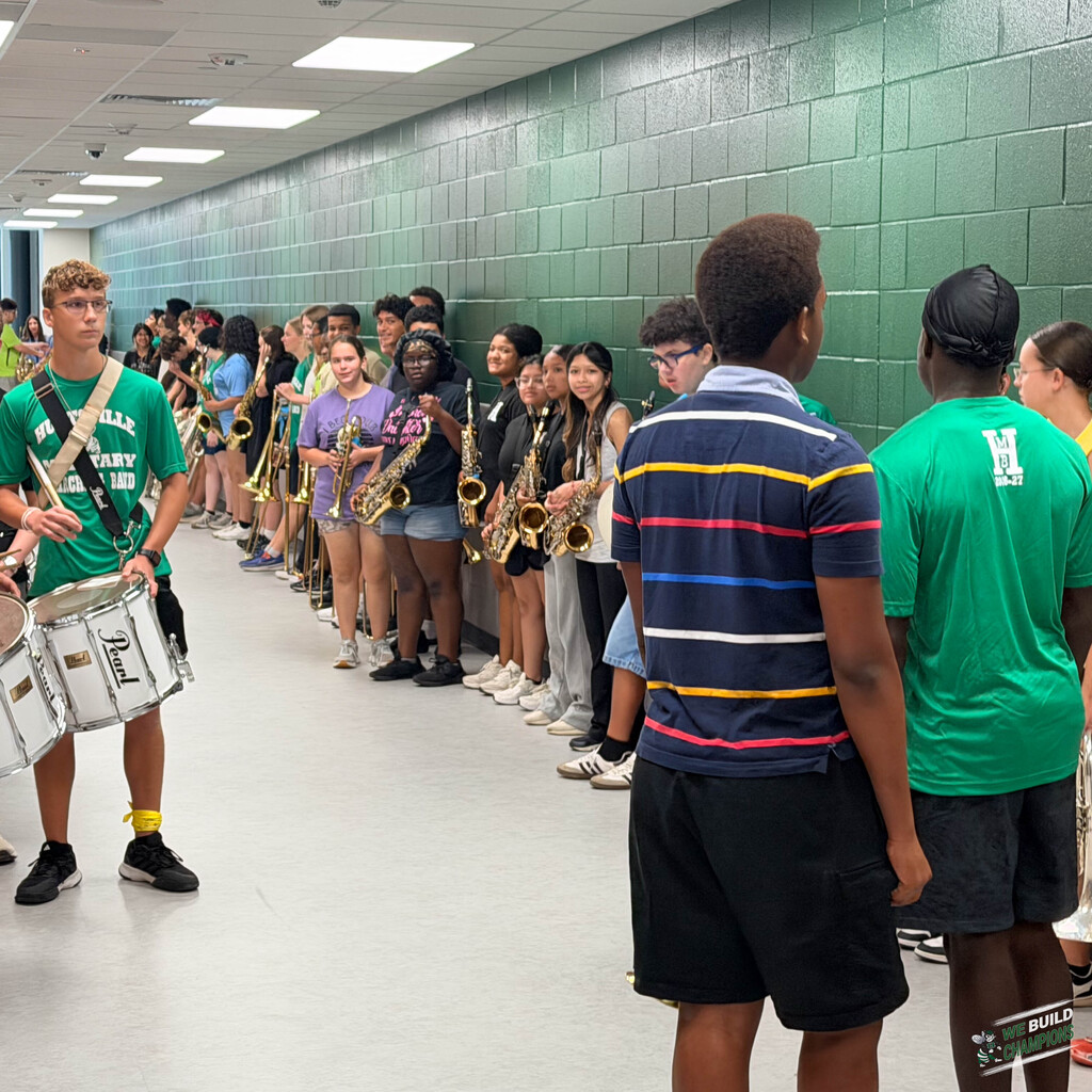 Band assembling in hallway next to the PAC