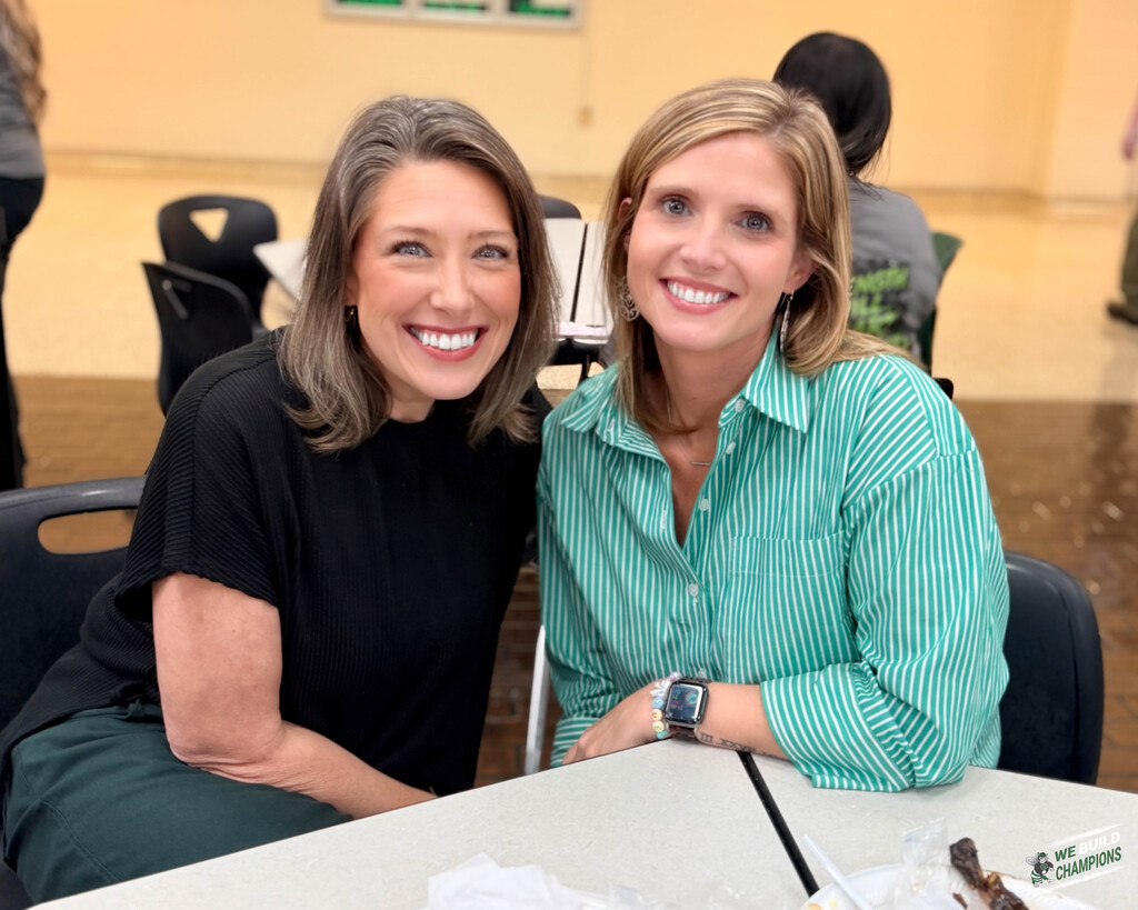 Two teachers smiling after lunch