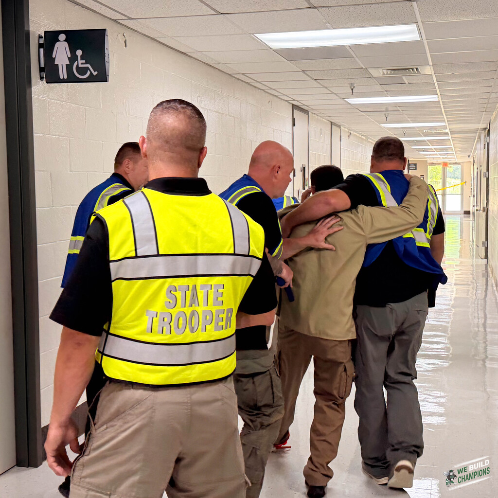 helping an "injured" person during training