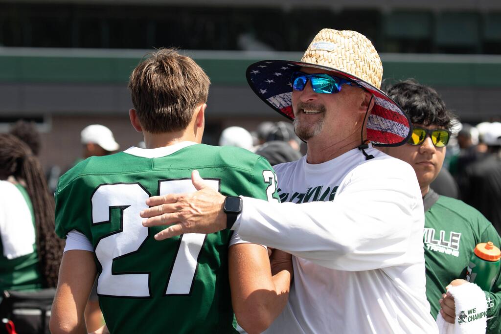 Coach smiling at freshman player