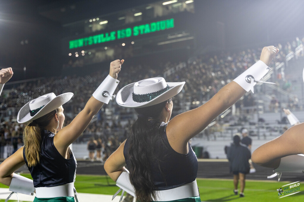 gg's cheering on with pressbox in background