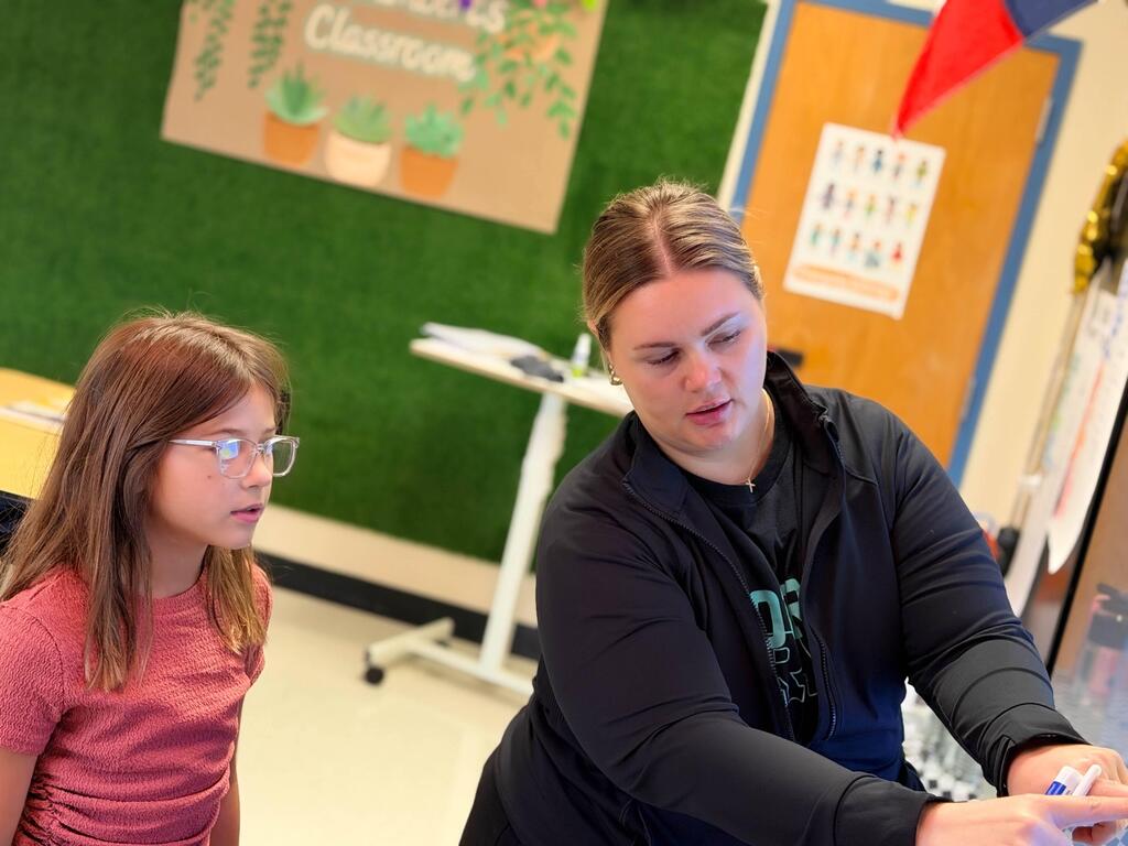 Girl watching the teacher- again, she looks like she is really thinking