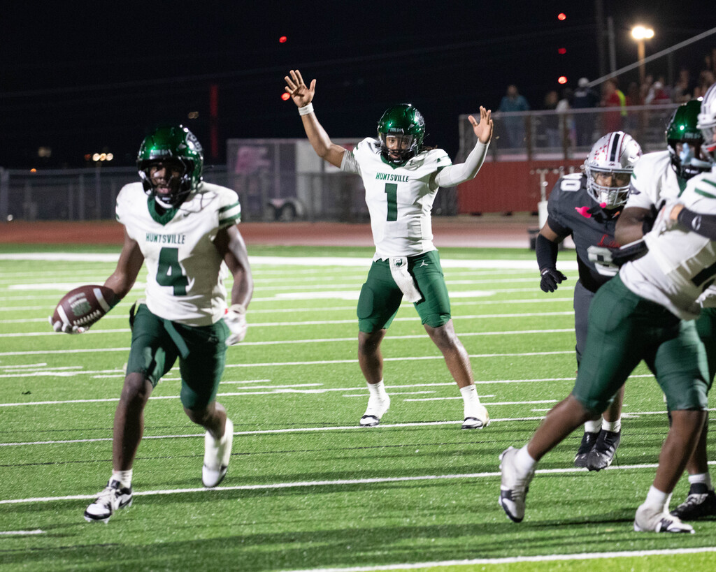 quarterback celebrates as running back enters the endzone