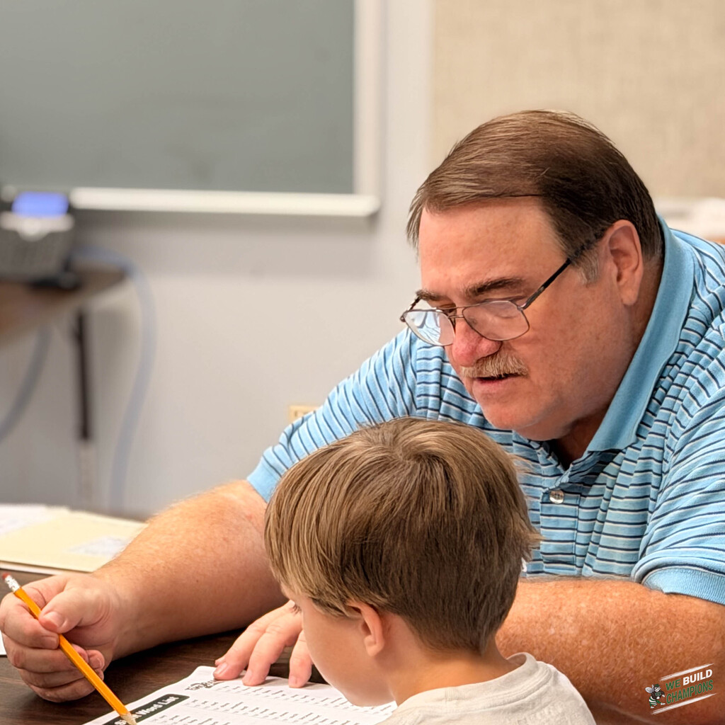 Man volunteer working with student