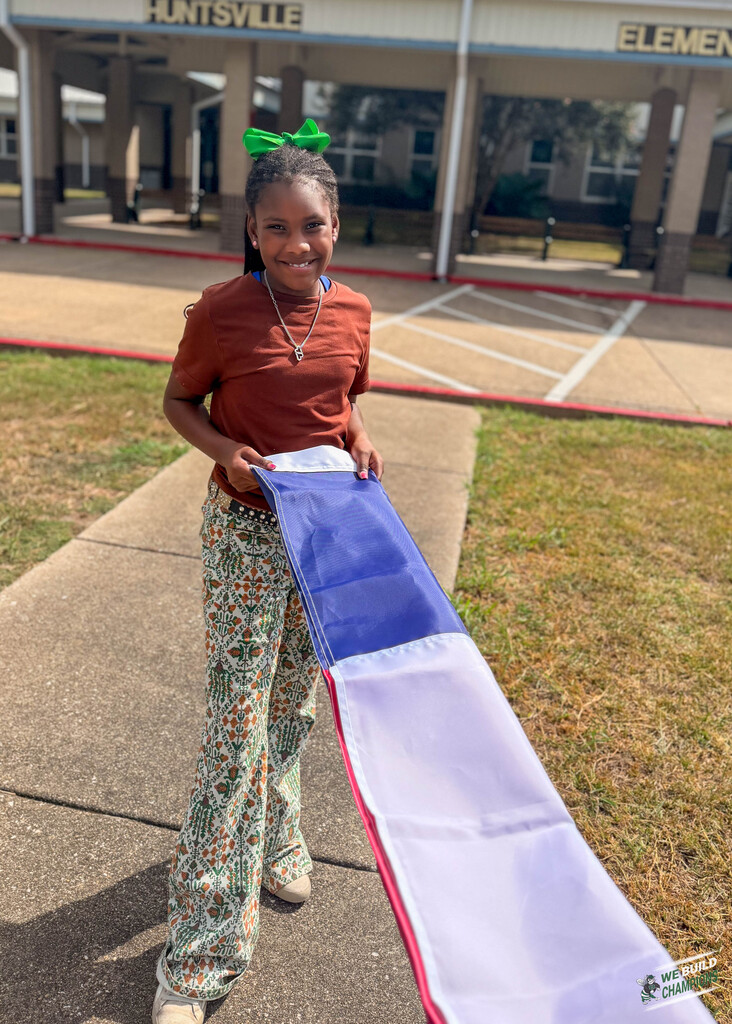 girl holding flag tight