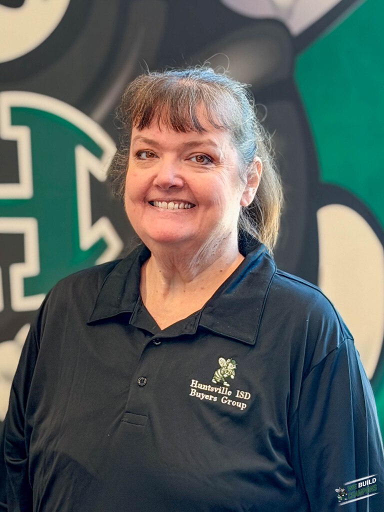 yearbook teacher wearing Buyers Group Shirt