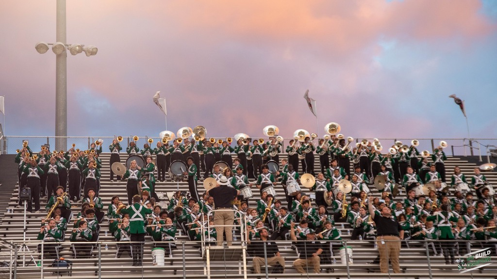 Band playing with the beautiful sky in the backgroun