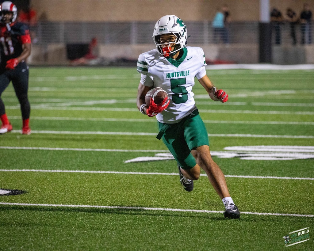 heading upfield with the ball
