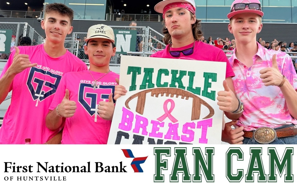 HHS Boys holding sign- "Tackle Breast Cancer"