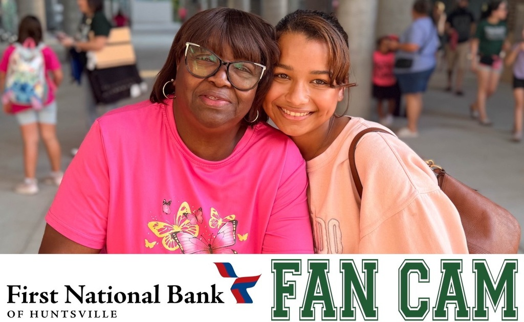 A grandma and her granddaughter posing