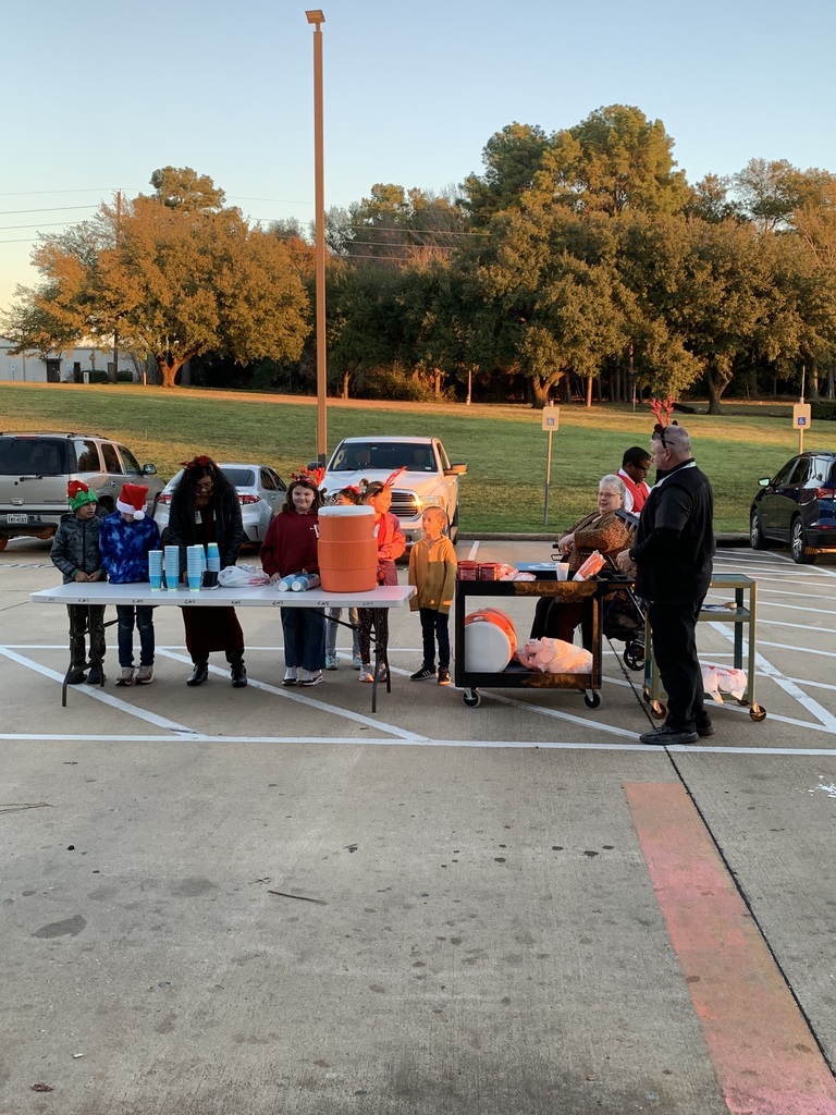 This morning, our SWHE Administration shared a cup of cheer with car rider parents and bus drivers, serving them hot chocolate as they arrived at the school.