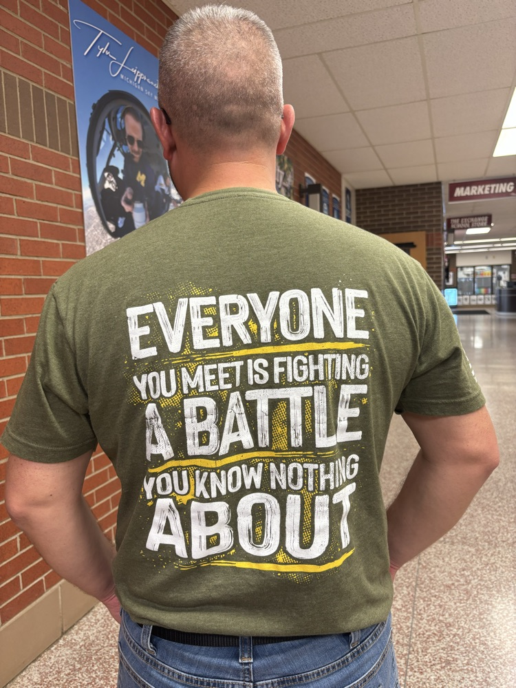 Mr. Ruth wearing a shirt with the message on the back  
