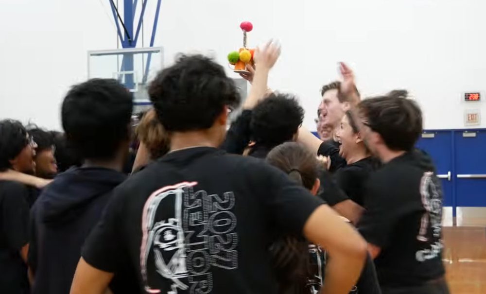 Photo of several students holding a unique trophy