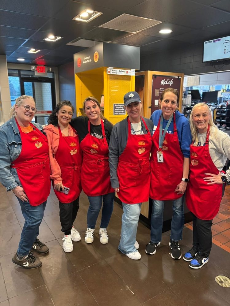 Oxbow staff working at McTeacher Night at McDonalds