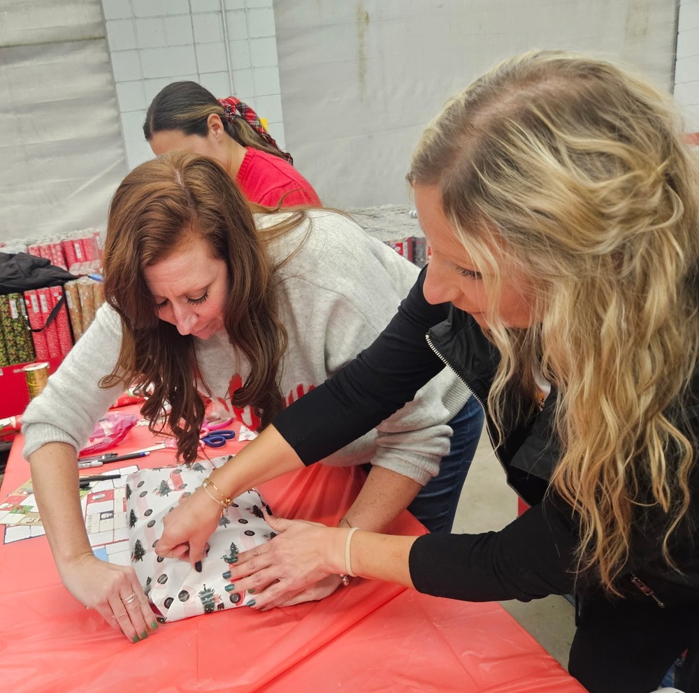 Teachers wrapping gifts