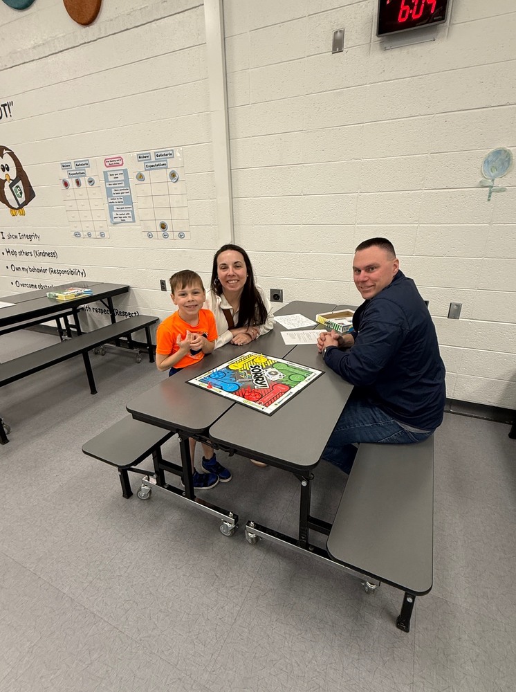 Oxbow family playing a game at Literacy Night