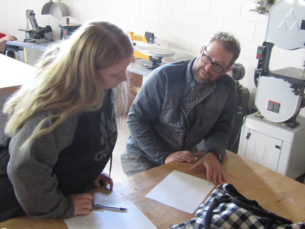 Mr. Lawson consults with a student in Art class