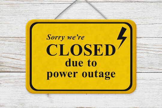 Yellow sign reading sorry no Class due to power outahe
