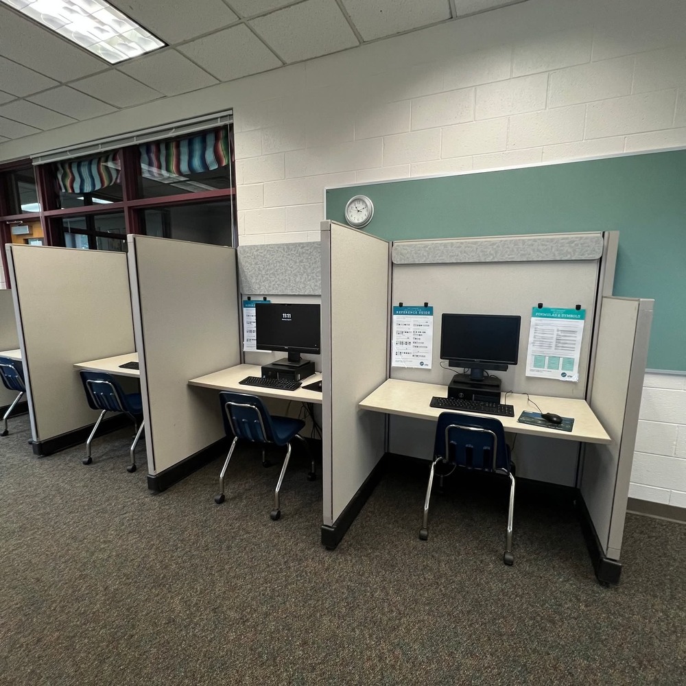 Testing center which has cubicles and chairs for privacy
