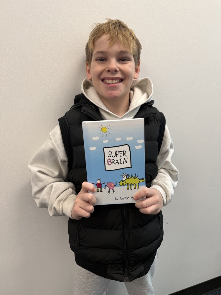 Colton McNulty with the book he wrote