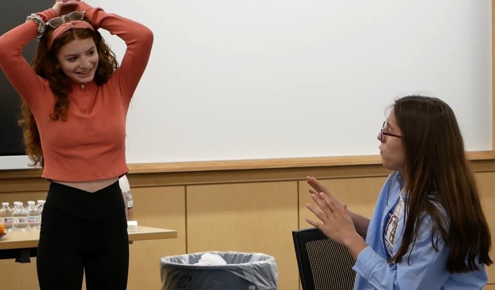 Two Students talking in classroom setting