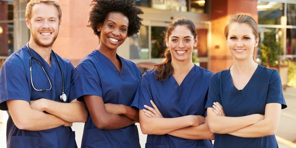 Cna professionals in Blue smiling