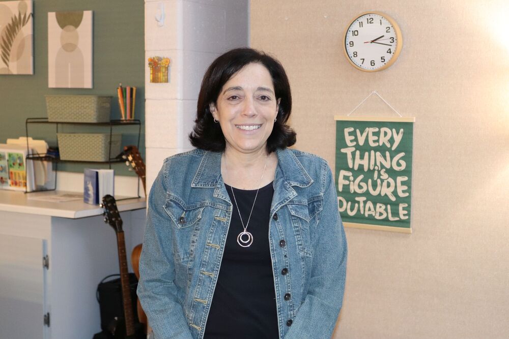 HHS New Social Worker Poses in Her Office