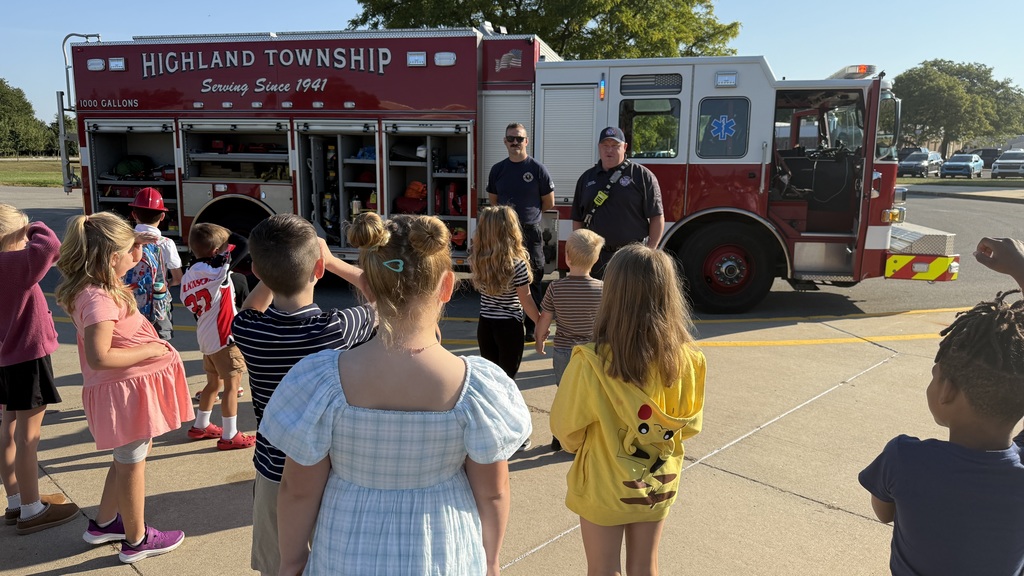 2nd grade class looks at firetruck