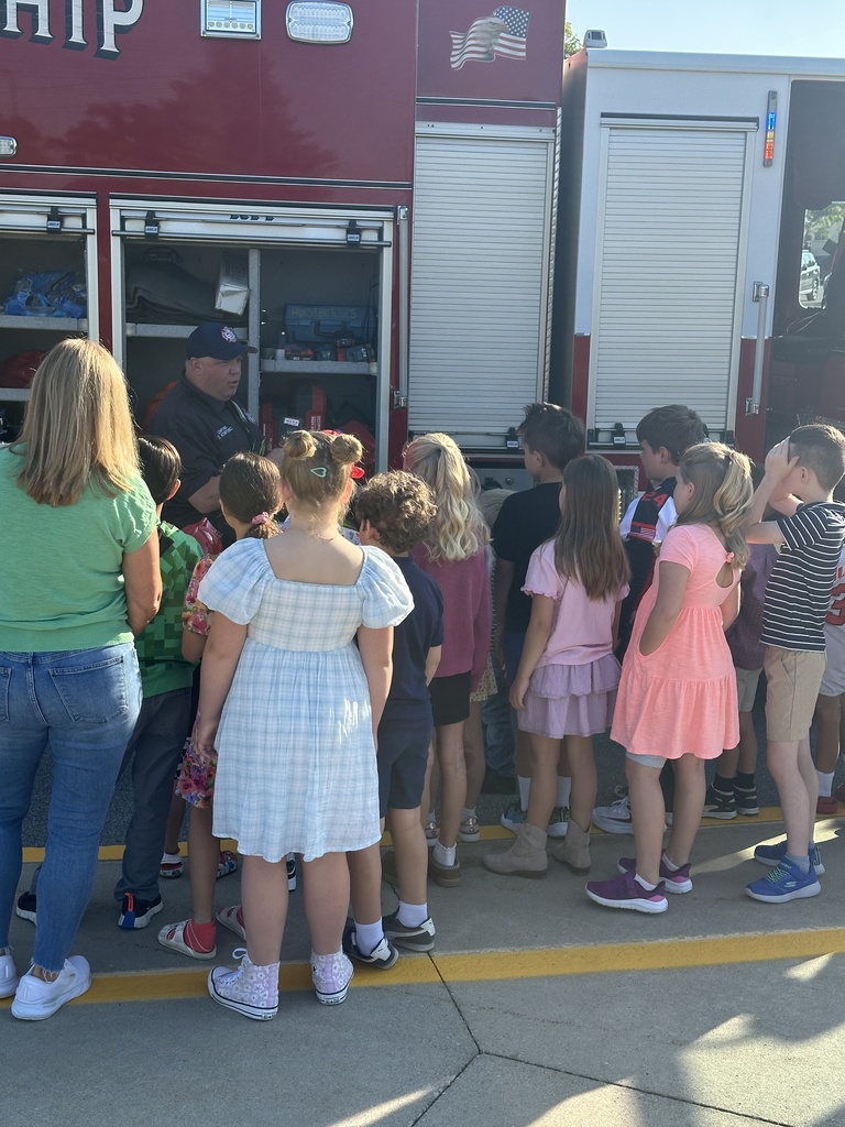 Fireman explains what is on a firetruck