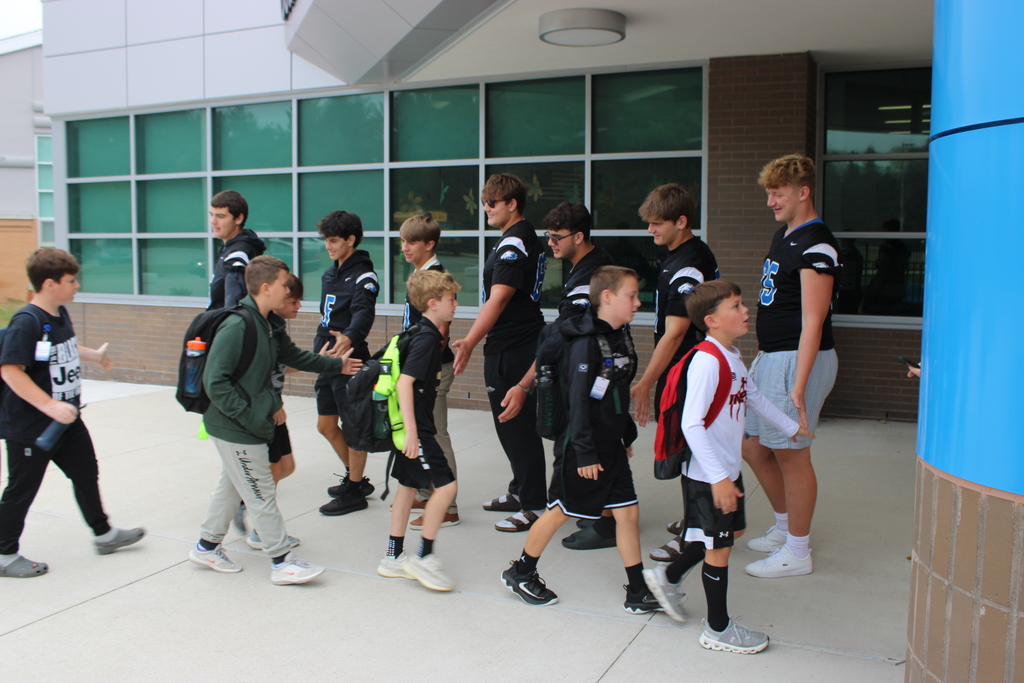 Lakeland Senior Football Players greeted students this morning at COE.