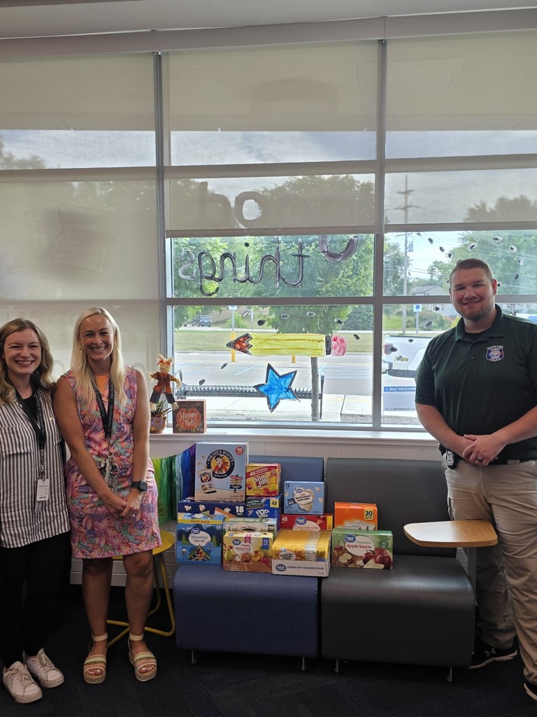 Mrs. Greenleaf and Mrs. Scanlon with Officer Welling and the White Lake Police Departments snack donations to Oxbow