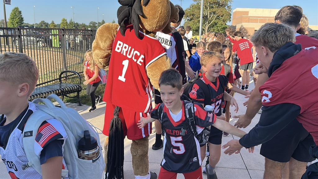 Heritage students being welcomed to school by Milford Students for Hoco2025