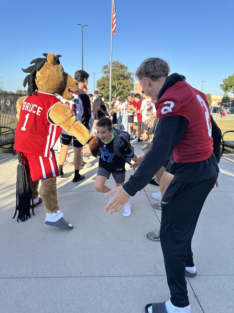 Heritage students being welcomed to school by Milford Students for Hoco2025