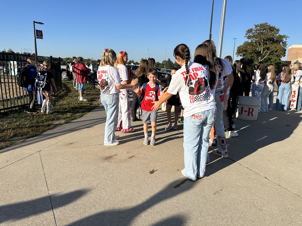 Heritage students being welcomed to school by Milford Students for Hoco2025