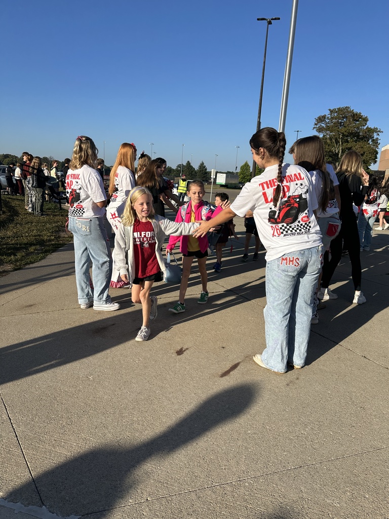 Heritage students being welcomed to school by Milford Students for Hoco2025