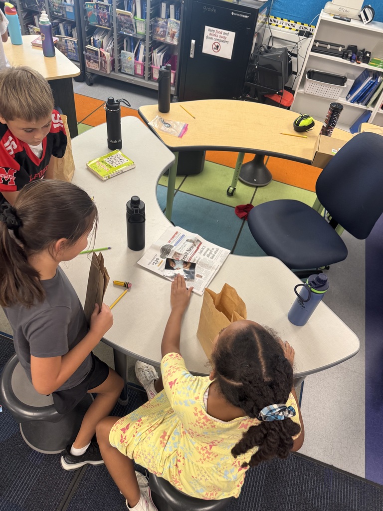 Students looking at artifacts