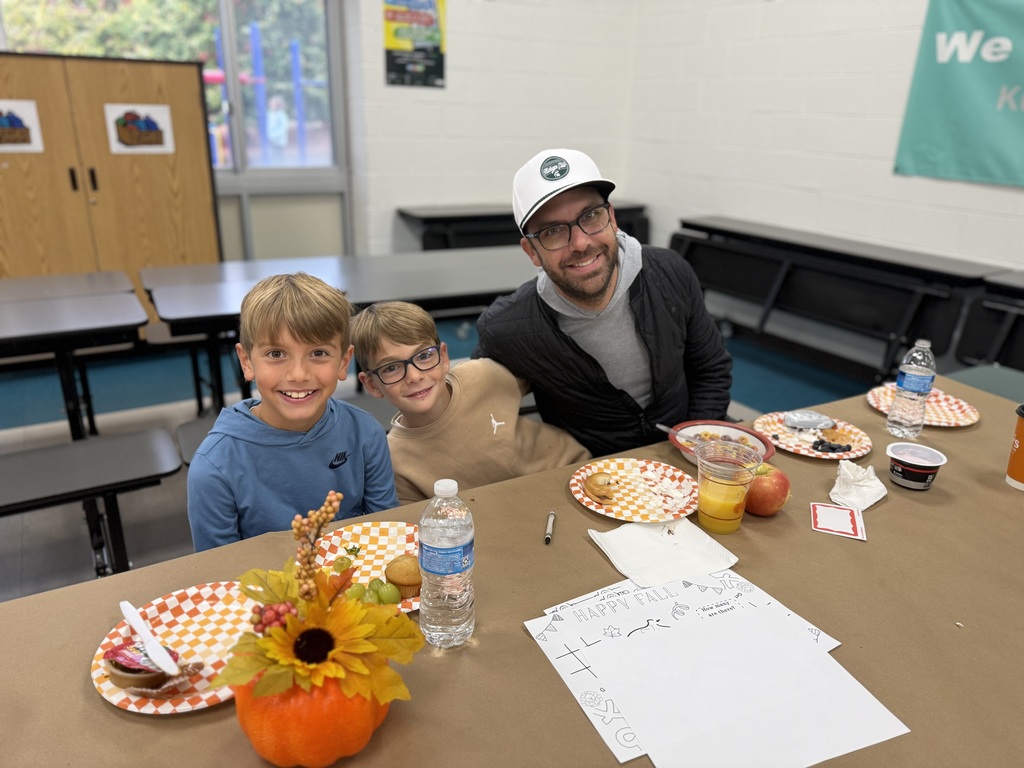 Families eating at Breakfast with a Buddy