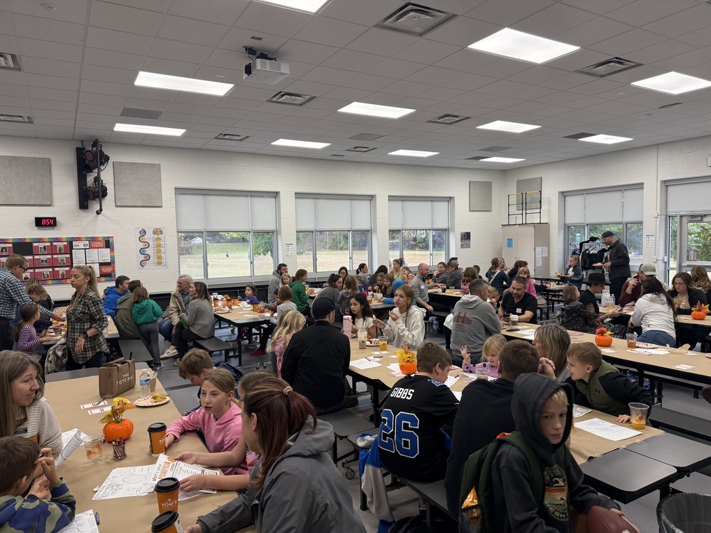Families eating at Breakfast with a Buddy