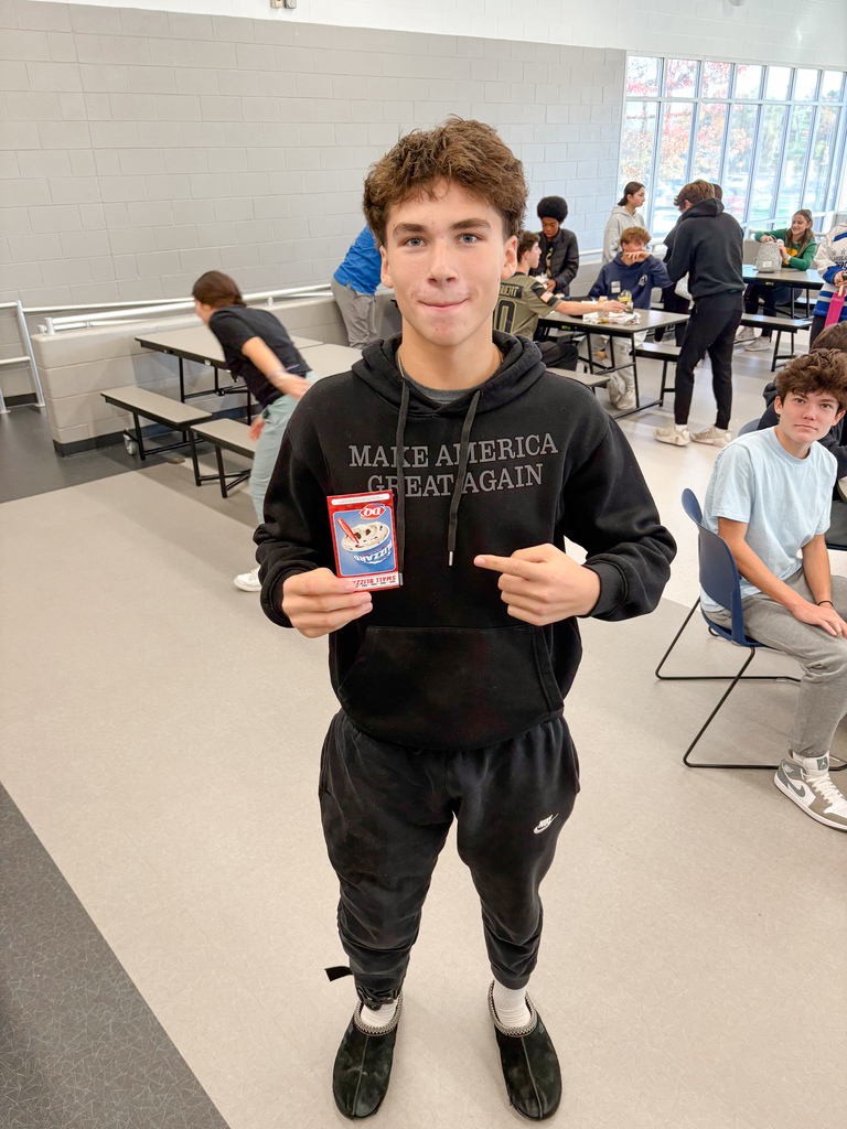 Boy holding a DQ gift certificate